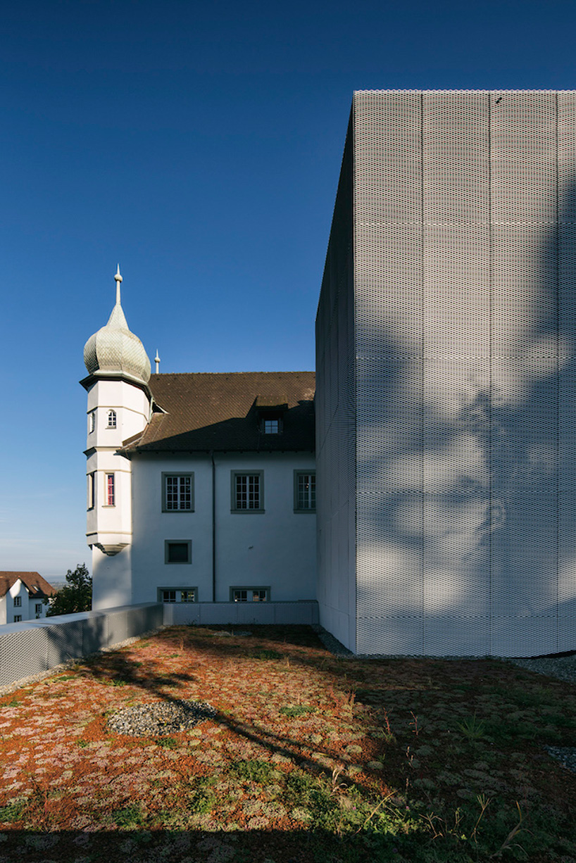 marte marte architects covers hofen castle extension in austria with translucent aluminum mesh designboom