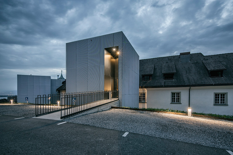 marte marte architects covers hofen castle extension in austria with translucent aluminum mesh designboom