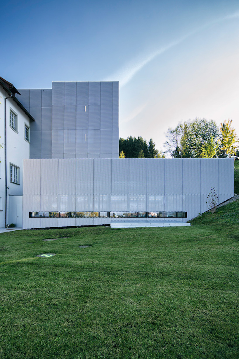 marte marte architects covers hofen castle extension in austria with translucent aluminum mesh designboom