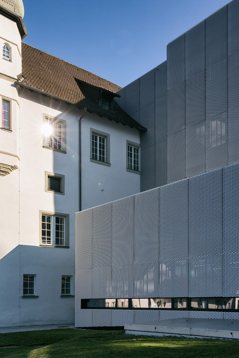 marte marte architects covers hofen castle extension in austria with translucent aluminum mesh designboom