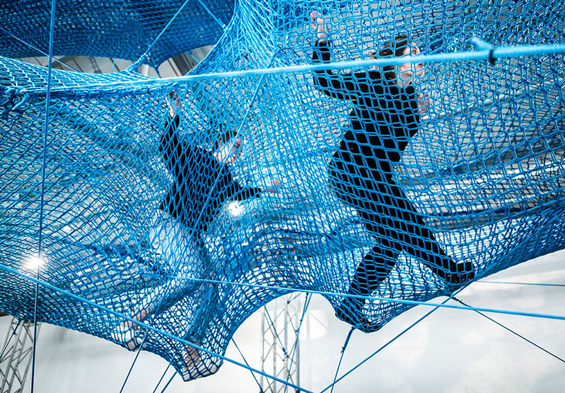 numen/for use constructs adult playground of woven blue tunnels in london car park