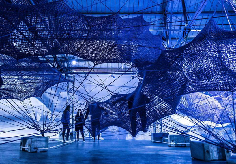 numen/for use constructs adult playground of woven blue tunnels in london car park