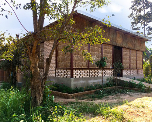 agriculture center in cambodia uses earth bricks, clay and bamboo for natural ventilation