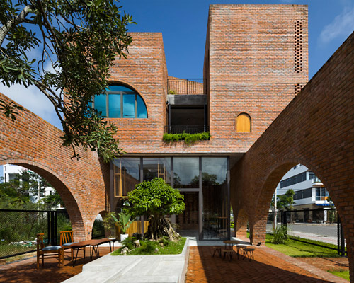 'cuckoo house' is a brick residence in vietnam that hovers above a coffee shop