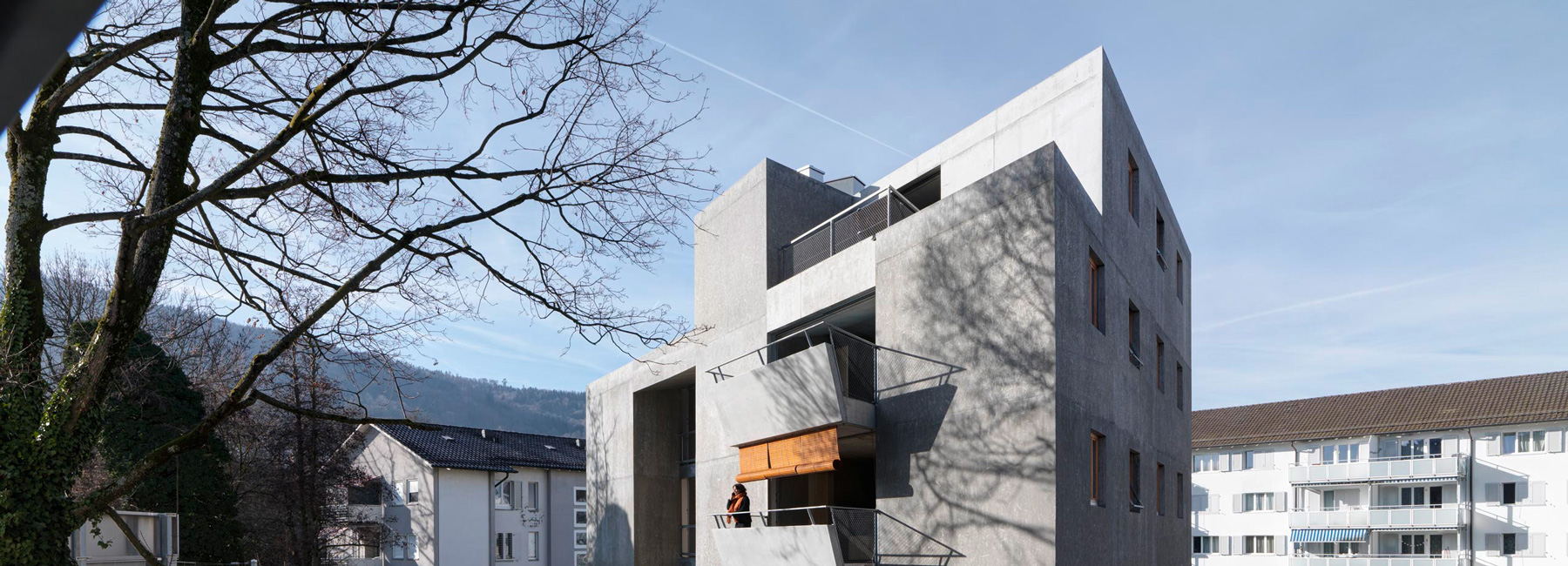 gus wüstemann architects' lowcost concrete housing block in zurich surburb