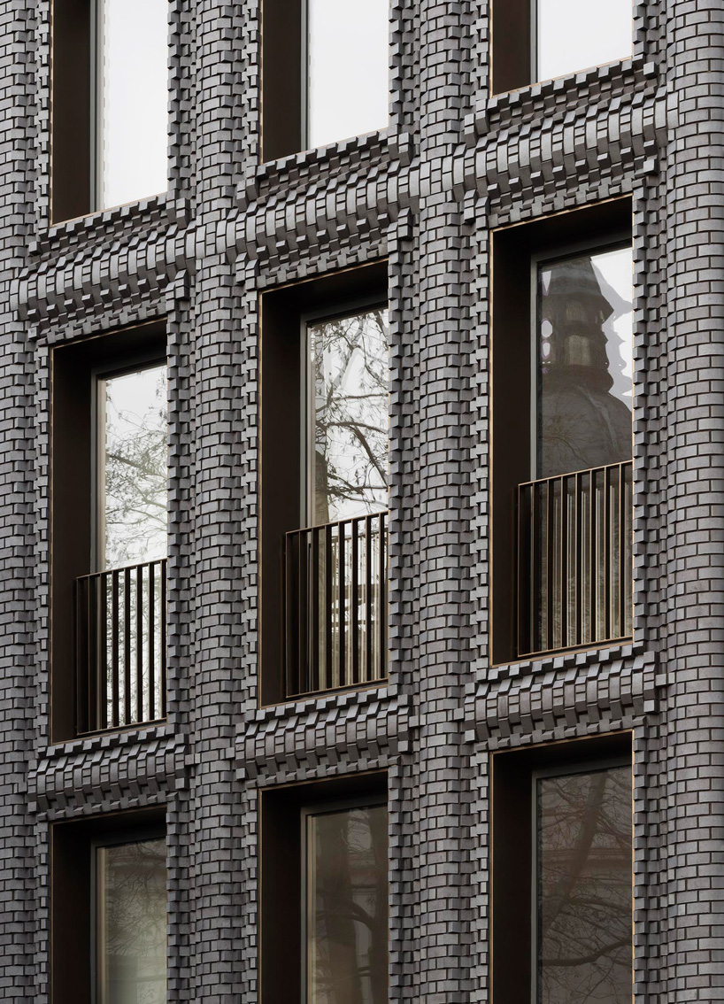 bureau de change architects clads london building in matte blue brick façade