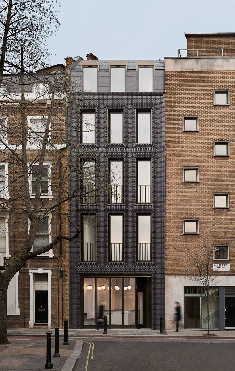 bureau de change architects clads london building in matte blue brick façade