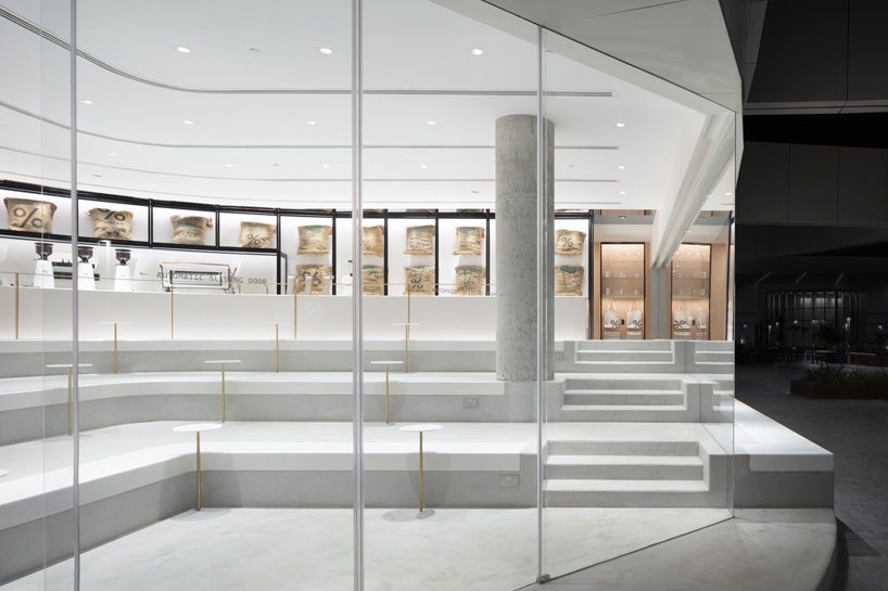 nendo designs stair-like interior for arabica coffee branch in kuwait
