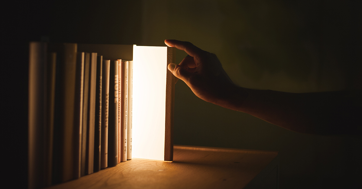 night book emits warm, soft light when pulled from bookcase