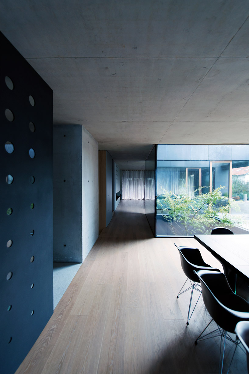 OFIS inserts an internal glazed atrium in the heart of 'house portico' in ljubljana designboom