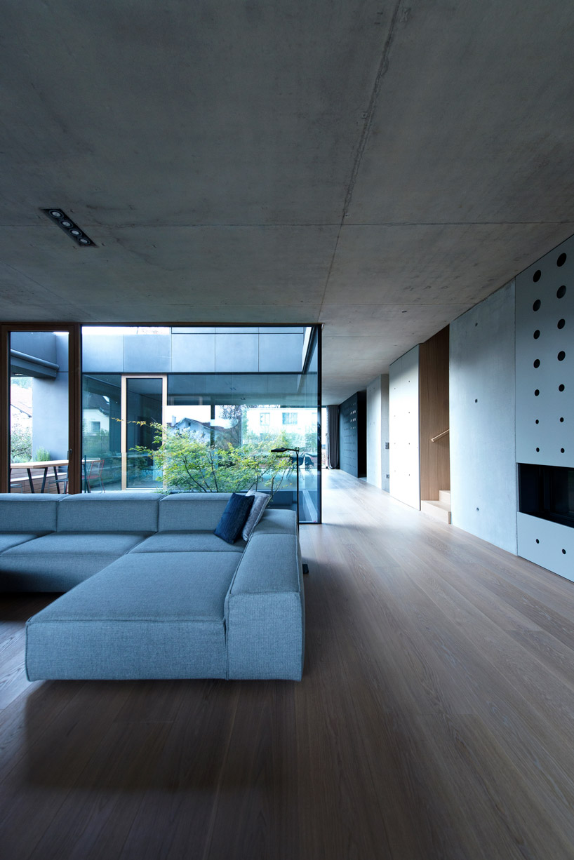 OFIS inserts an internal glazed atrium in the heart of 'house portico' in ljubljana designboom