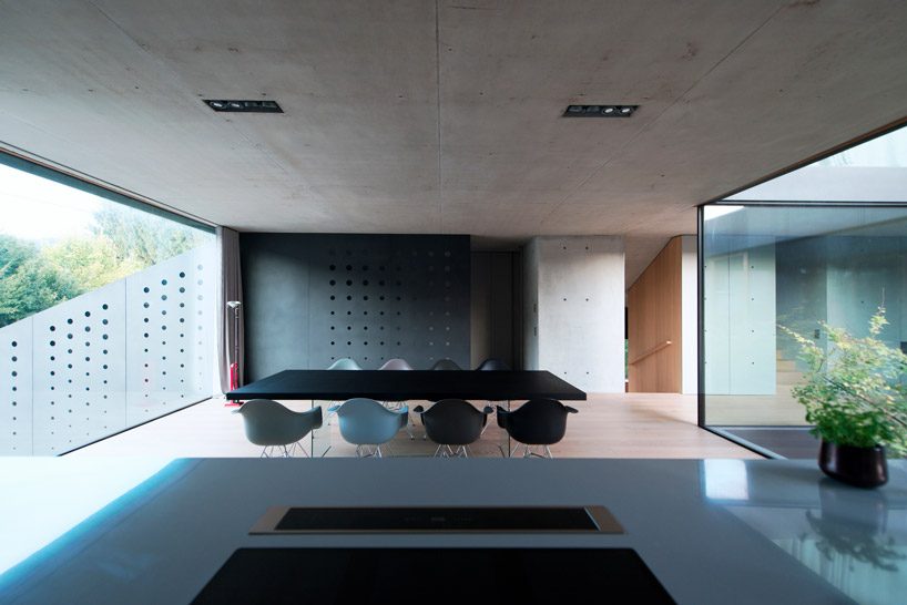 OFIS inserts an internal glazed atrium in the heart of 'house portico' in ljubljana designboom