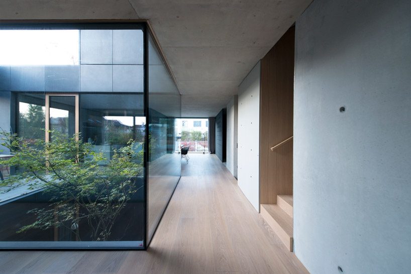 OFIS inserts an internal glazed atrium in the heart of 'house portico' in ljubljana designboom