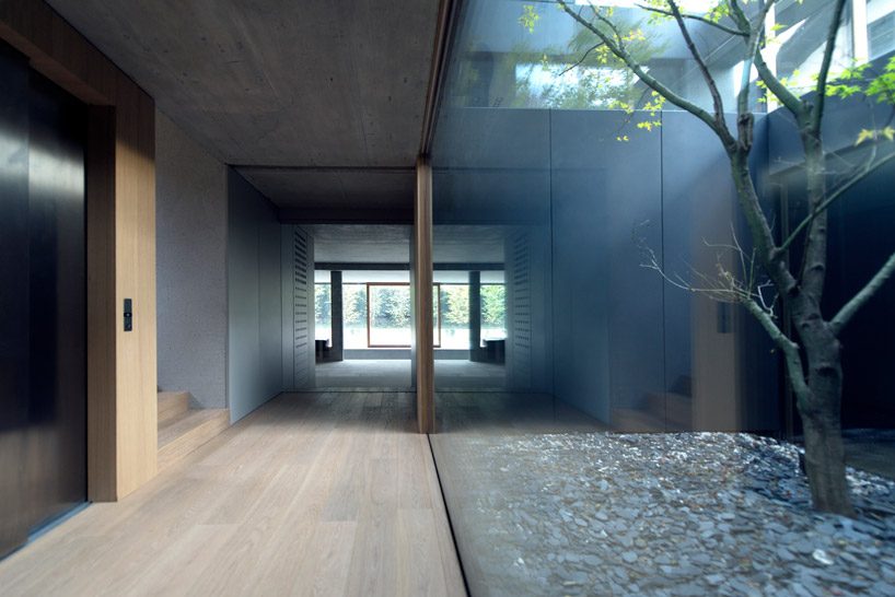 OFIS inserts an internal glazed atrium in the heart of 'house portico' in ljubljana designboom