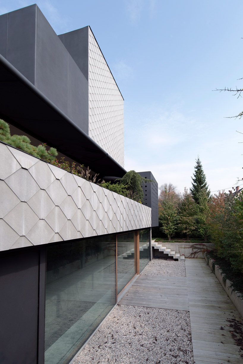 OFIS inserts an internal glazed atrium in the heart of 'house portico' in ljubljana designboom
