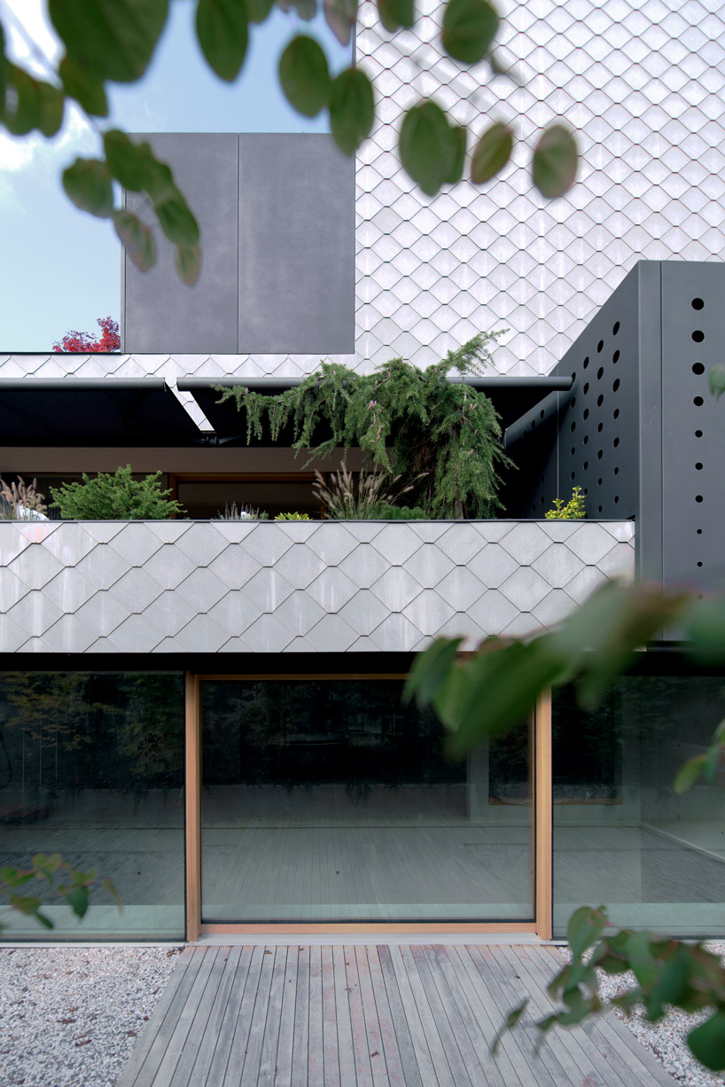 OFIS inserts an internal glazed atrium in the heart of 'house portico' in ljubljana designboom