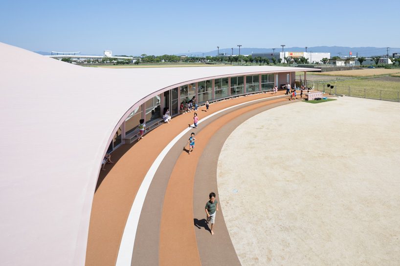 ryuji fujimura tops subaru nursery school in japan with curved concrete roof
