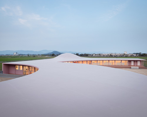 ryuji fujimura tops subaru nursery school in japan with curved concrete roof