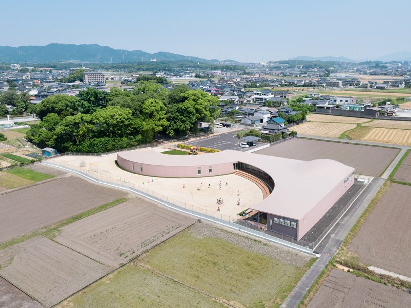 ryuji fujimura tops subaru nursery school in japan with curved concrete roof