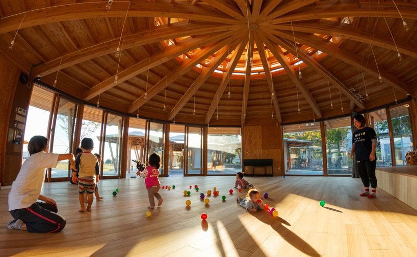 tezuka architects forms array of round timber structures for 'muku nursery' in japan designboom