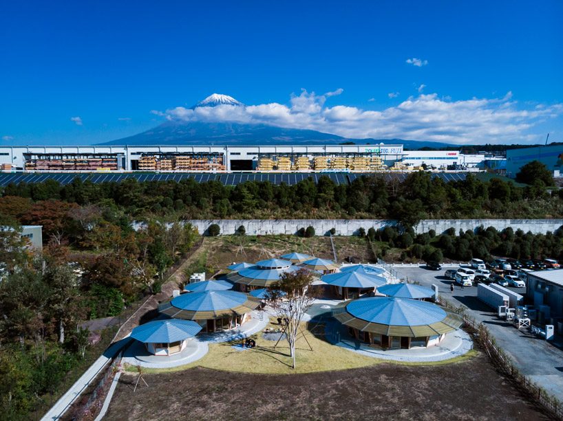tezuka architects forms array of round timber structures for 'muku nursery' in japan designboom