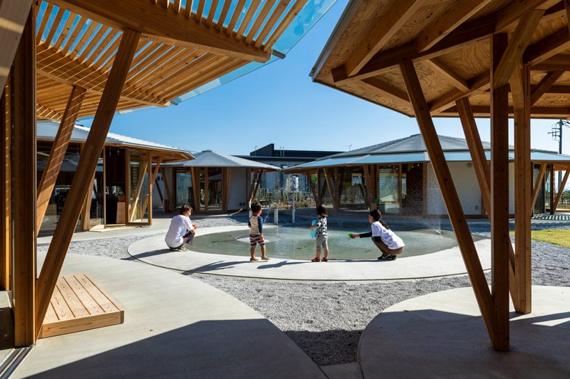 tezuka architects forms array of round timber structures for 'muku nursery' in japan designboom
