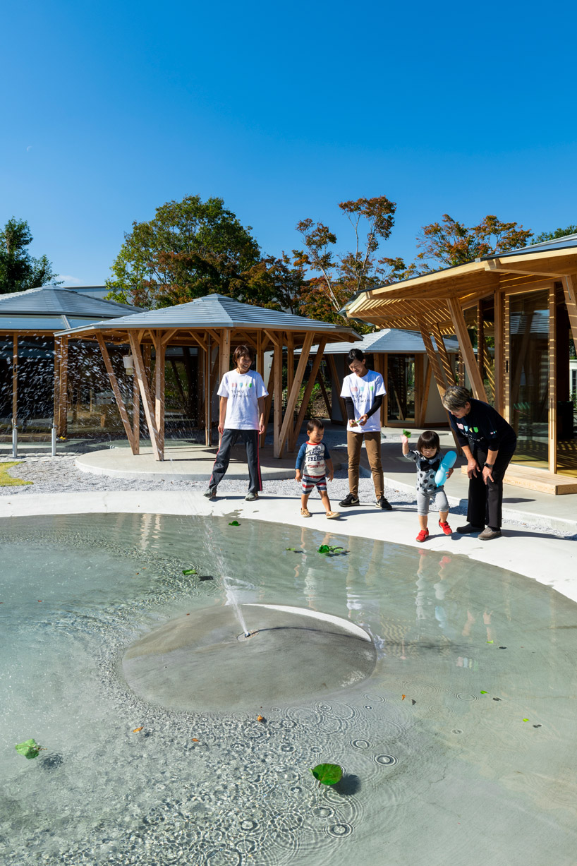 tezuka architects forms array of round timber structures for 'muku nursery' in japan designboom