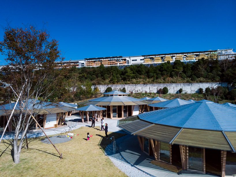 tezuka architects forms array of round timber structures for 'muku nursery' in japan designboom