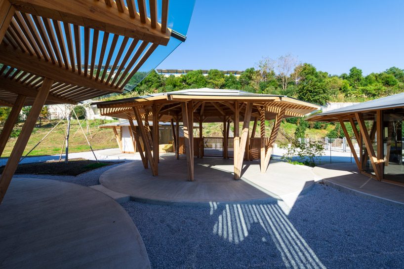 tezuka architects forms array of round timber structures for 'muku nursery' in japan designboom