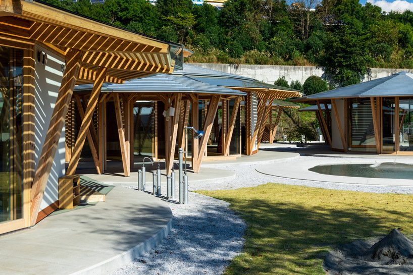 tezuka architects forms array of round timber structures for 'muku nursery' in japan designboom