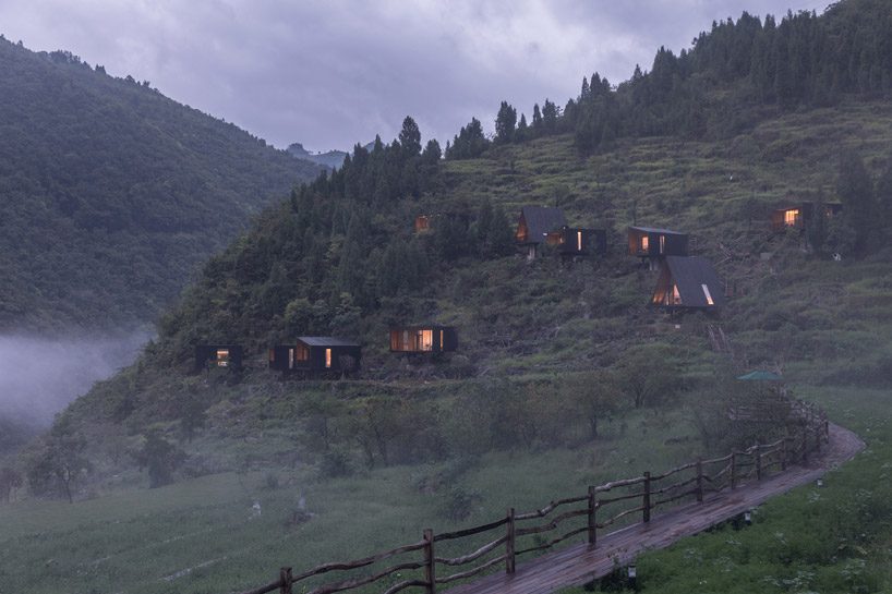 ZJJZ builds charred timber volumes on a hillside in rural china for 'woodhouse hotel' designboom