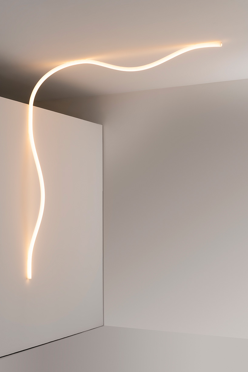 la linea by BIG for artemide, a luminous strip that moves freely in space designboom
