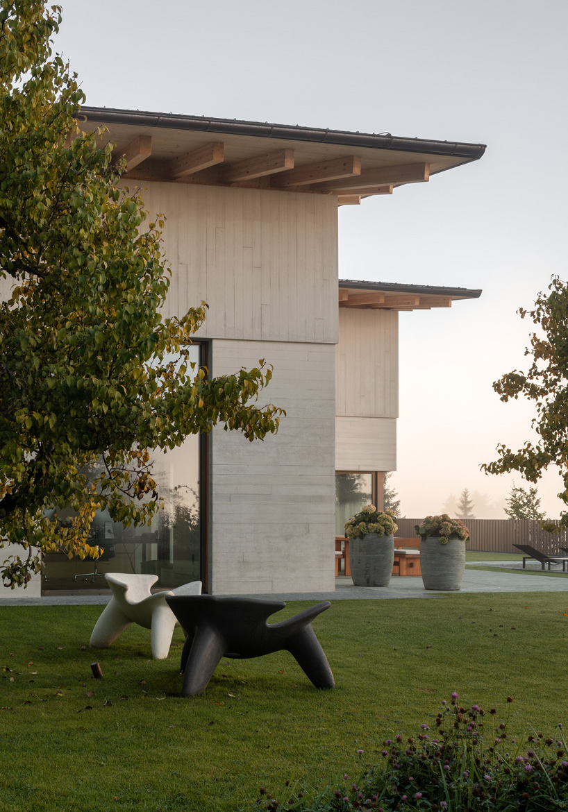 john pawson combines three barn-like volumes into alpine house in kitzbühel, austria