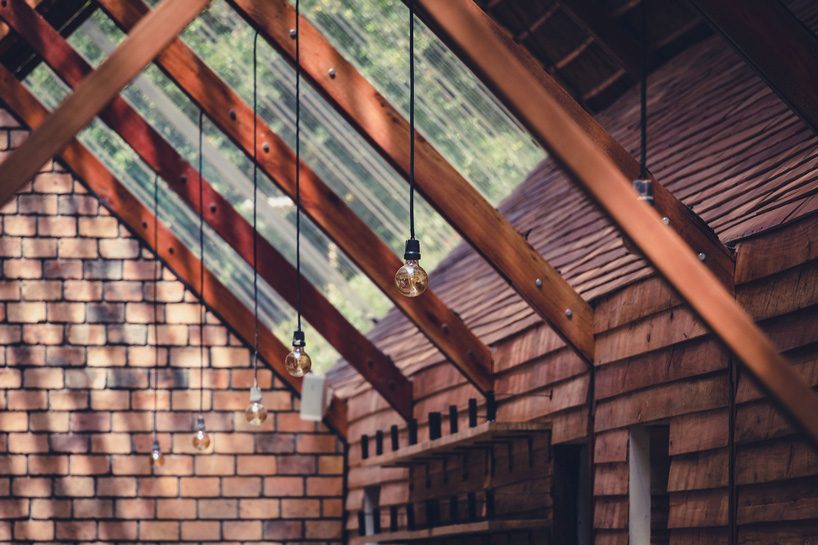 terrain architects builds multipurpose building using local eucalyptus in uganda