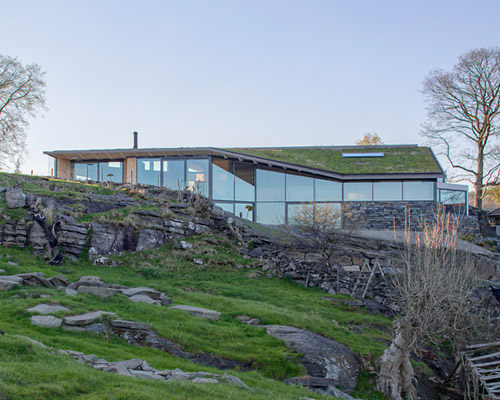 norwegian island house expressed with folded surfaces and rhythmic timber structure