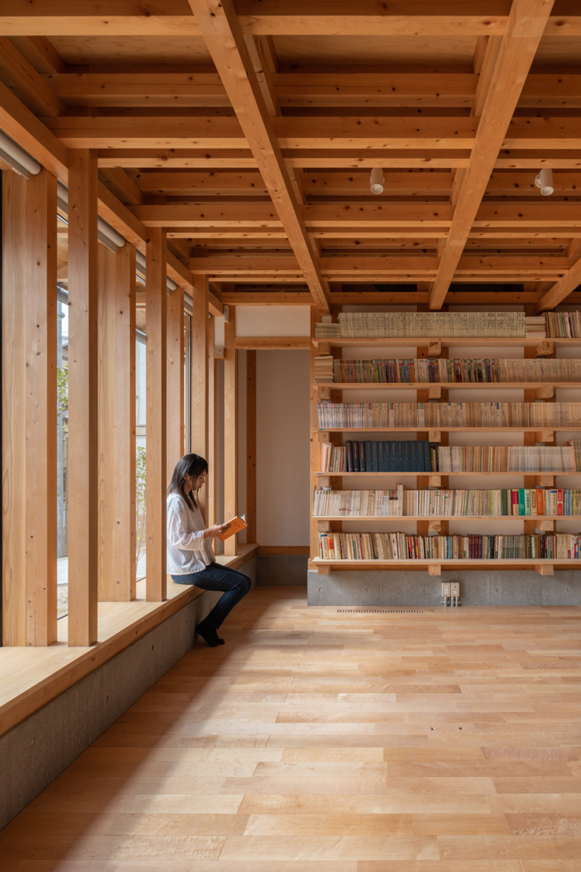 kazuya morita builds wooden lattice frame structure for archive library in kyoto - 2