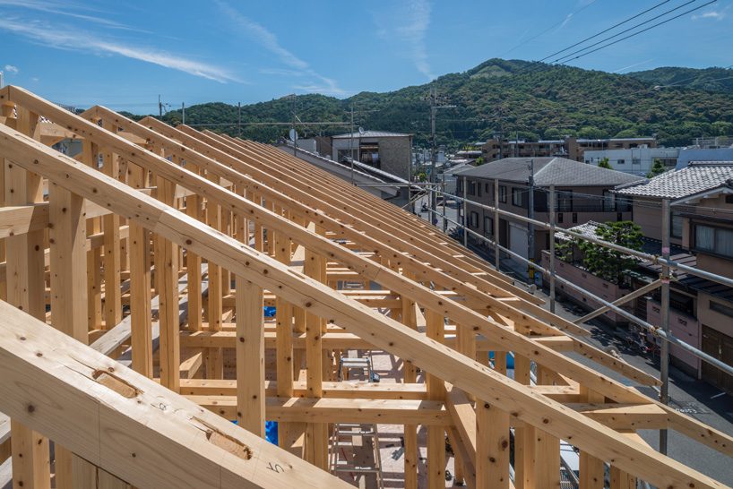 kazuya morita builds wooden lattice frame structure for archive library in kyoto - 9