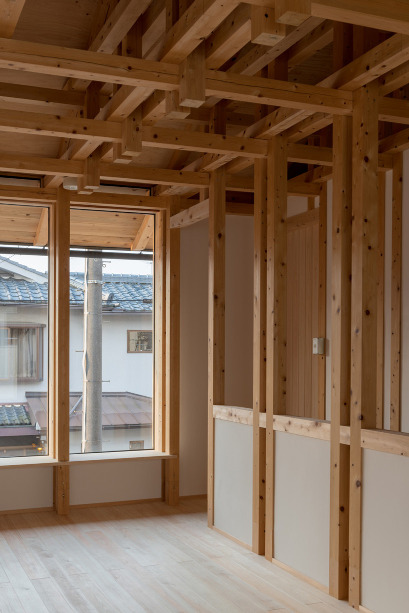 kazuya morita builds wooden lattice frame structure for archive library in kyoto