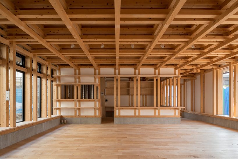 kazuya morita builds wooden lattice frame structure for archive library in kyoto
