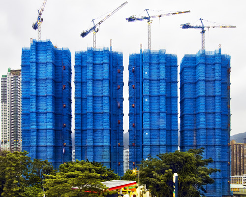 peter steinhauer captures the colorful bamboo scaffolding dressing hong kong's skyscrapers