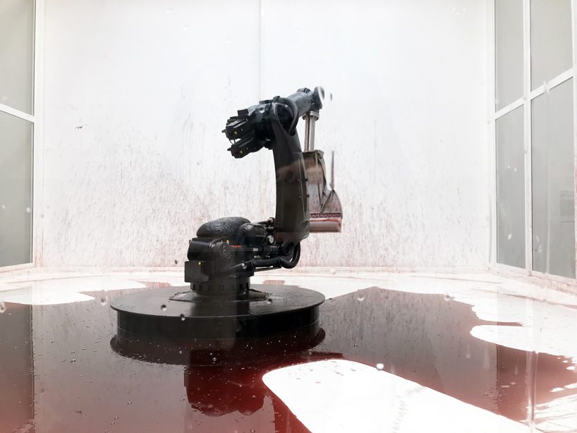 industrial robot continuously sweeps blood-like fluid in sun yuan + peng yu's 'can't help myself'