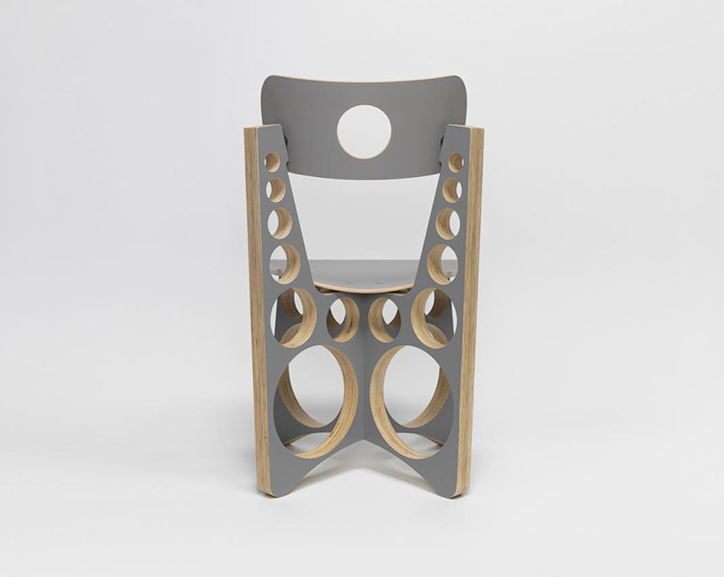 tom sachs punctuates circular holes throughout limited gray edition of shop chair designboom