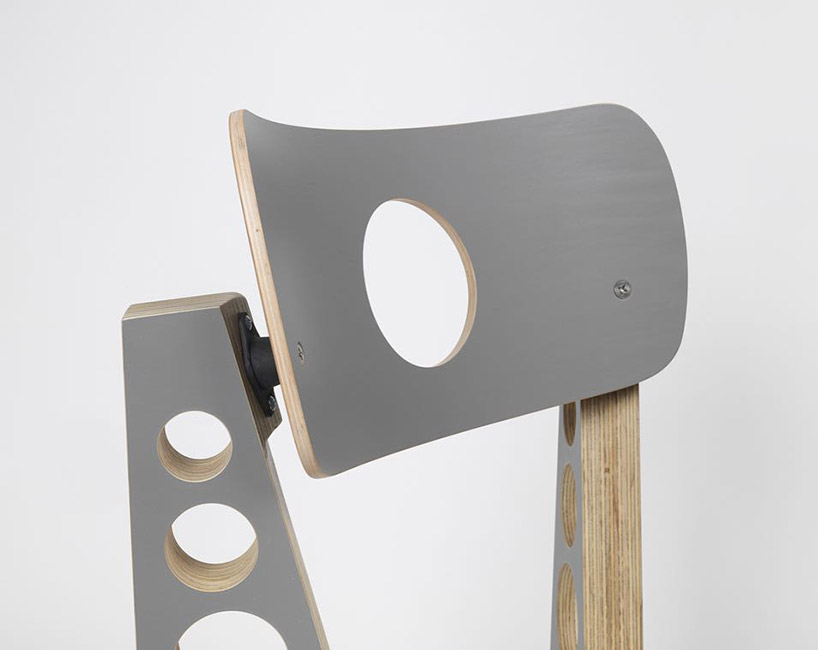 tom sachs punctuates circular holes throughout limited gray edition of shop chair designboom