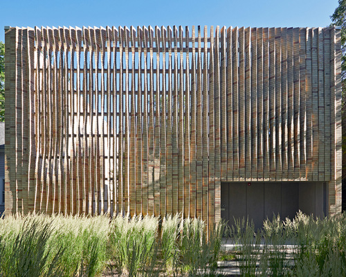the façade of this house in chicago boasts an array of twisting brick columns
