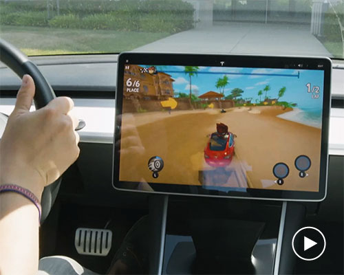 elon musk reveals in-car video game that can be played using the tesla steering wheel