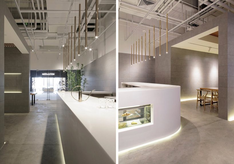 jun murata / JAM uses exposed concrete and brass accents for shanghai's cafe la loop 86 designboom