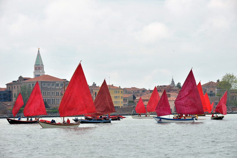 melissa mcgill choreographs 50 traditional sailboats with red sails in the venetian lagoon