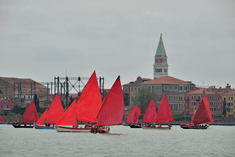 melissa mcgill choreographs 50 traditional sailboats with red sails in the venetian lagoon