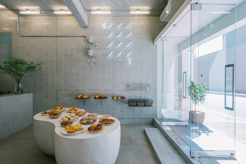 fathom designs japanese bakery ripi as a continuous space of concrete and glass