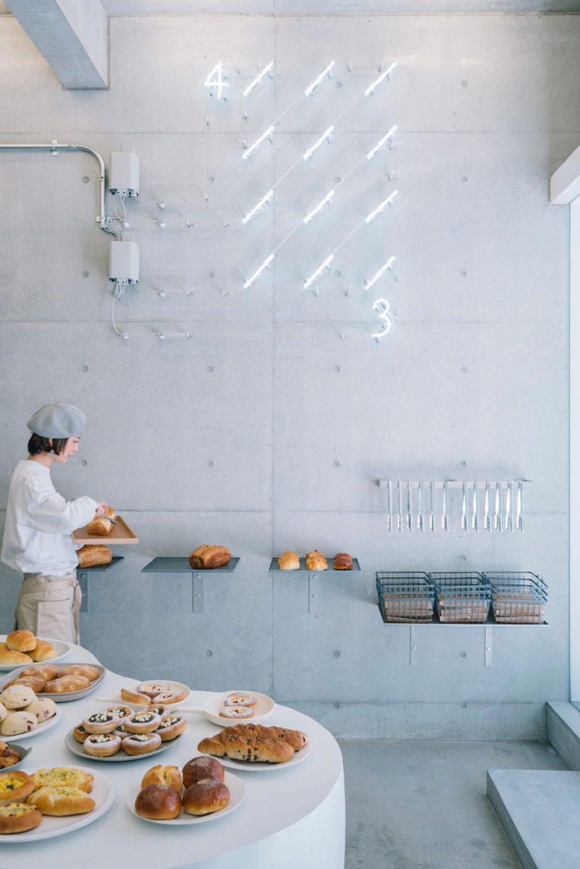 fathom designs japanese bakery ripi as a continuous space of concrete and glass